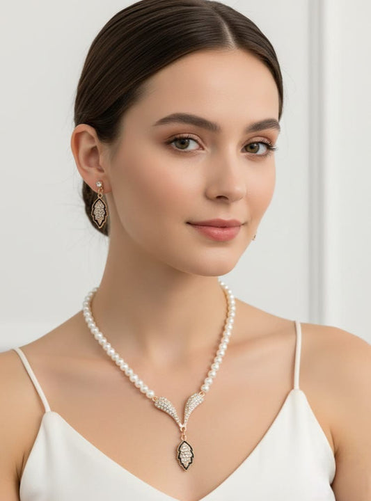 Elegant Faux Pearl Necklace and Earring Set with Crystal-Encrusted Leaf Pendant - Luxurious Gold-Tone Bridal Jewelry for Women